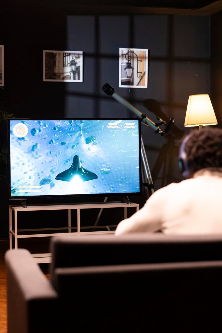gamer-front-widescreen-smart-tv-watching-sf-videogame-gameplay_482257-82211